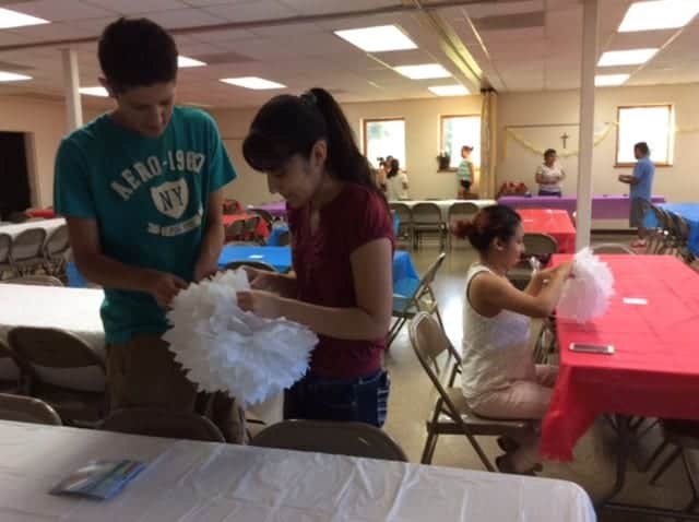 Members of the Anunciation Church in California help with preparations for the celebration.